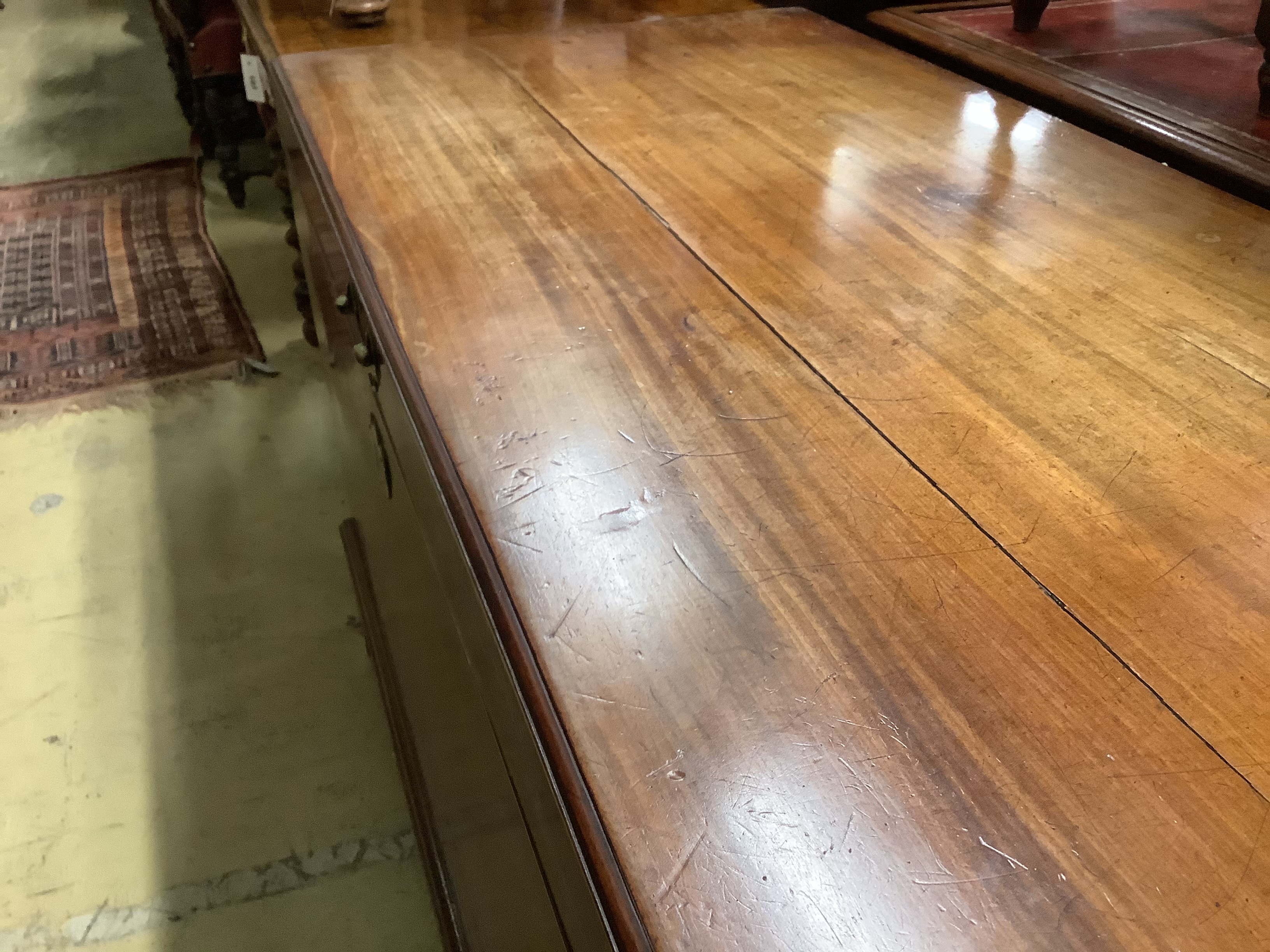 A George III mahogany coffer, with brass loop handles, on bracket feet (cracked), length 122cm, depth 60cm, height 76cm